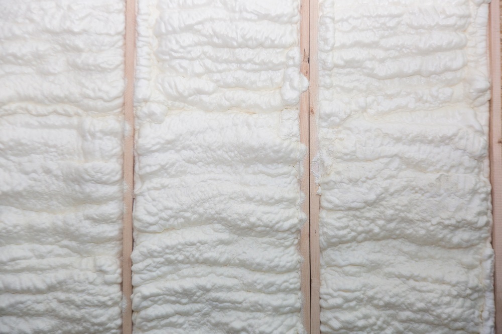 The wall of a new wooden house in foam for insulation and heat