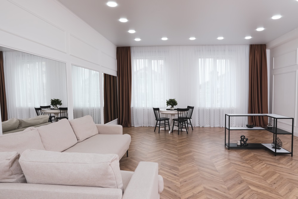 Modern room with parquet flooring and stylish furniture