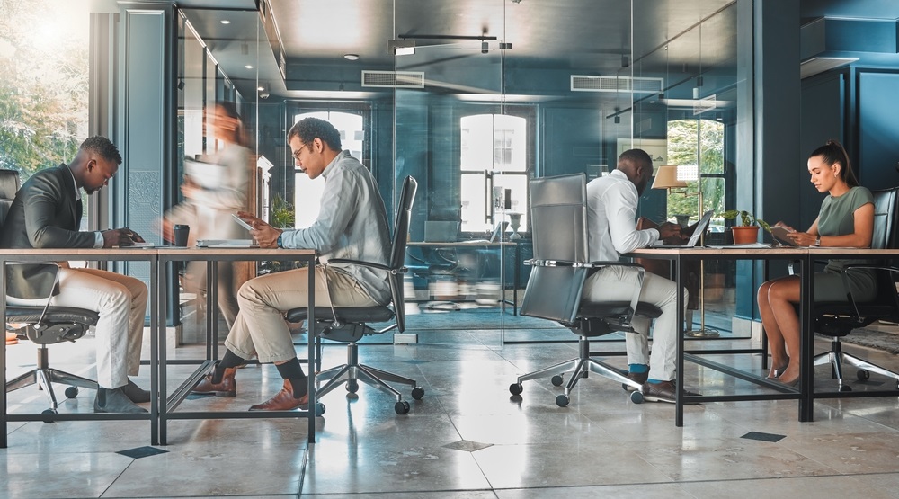 Coworking space, office and sharing desk in corporate workplace