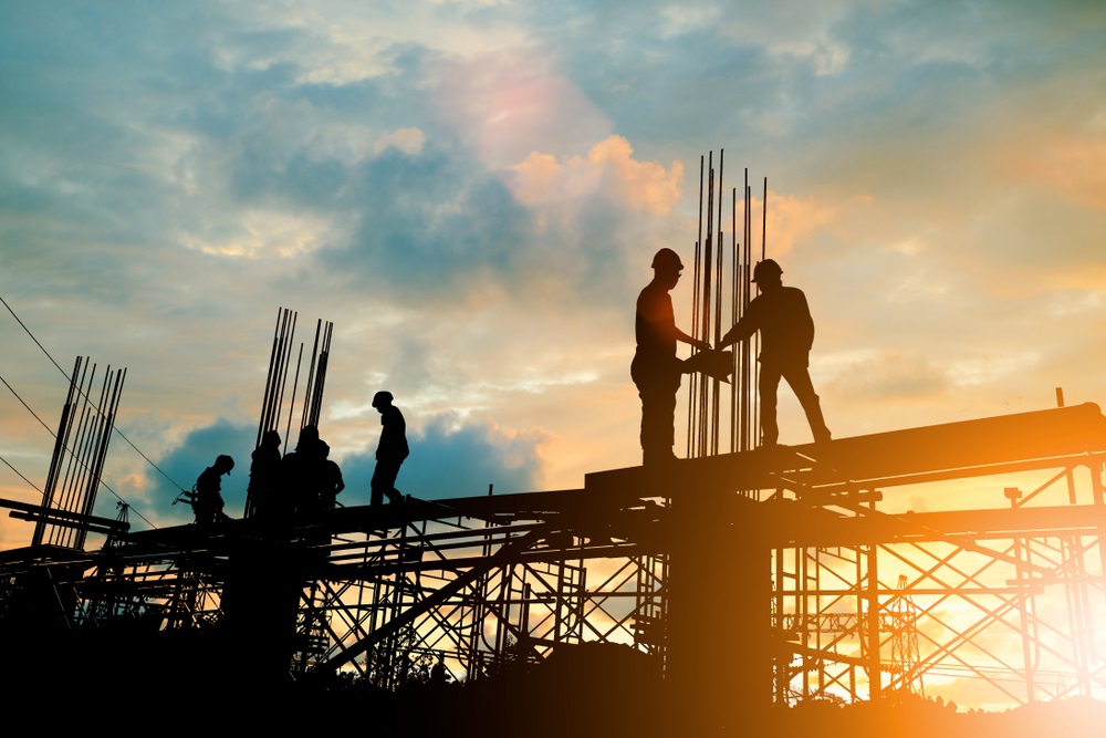 Silhouette of engineer and construction team working at site