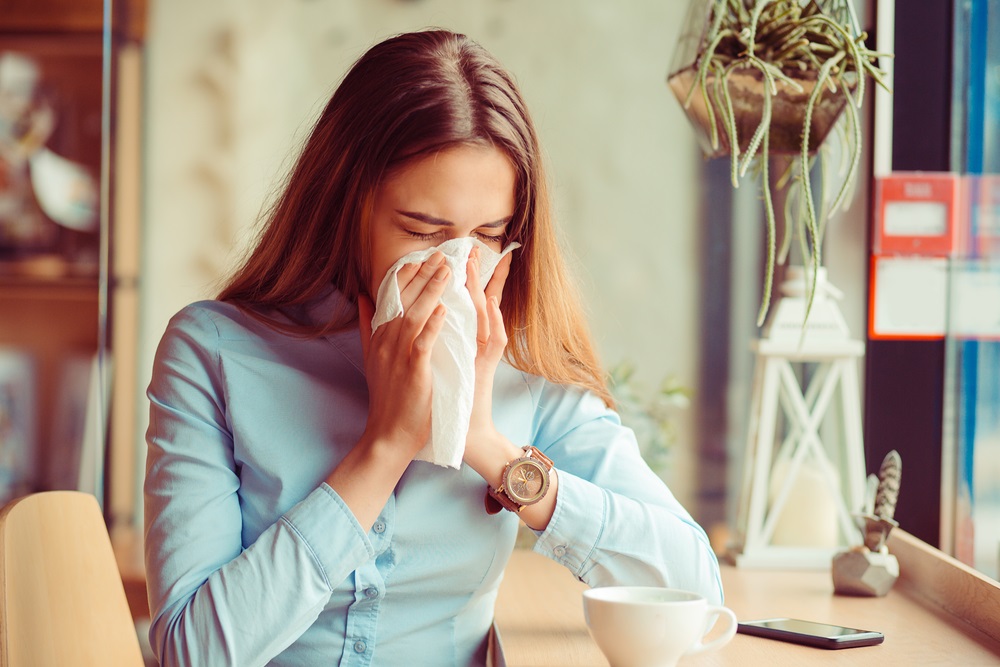 Young woman got runny nose from allergy