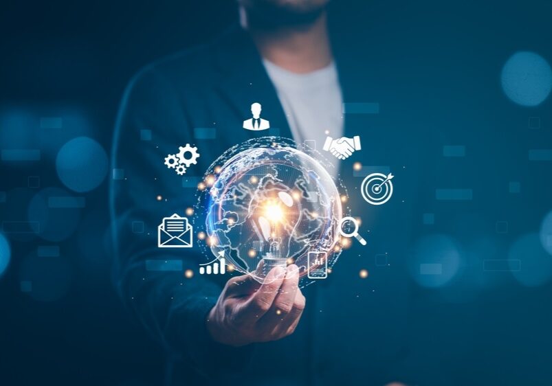businessman holding light blub with virtual Global Internet connection