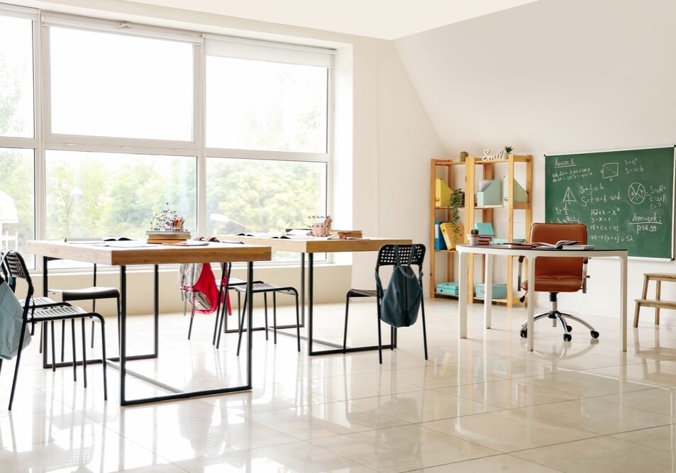 Interior of classroom with desks Interior of classroom with desks