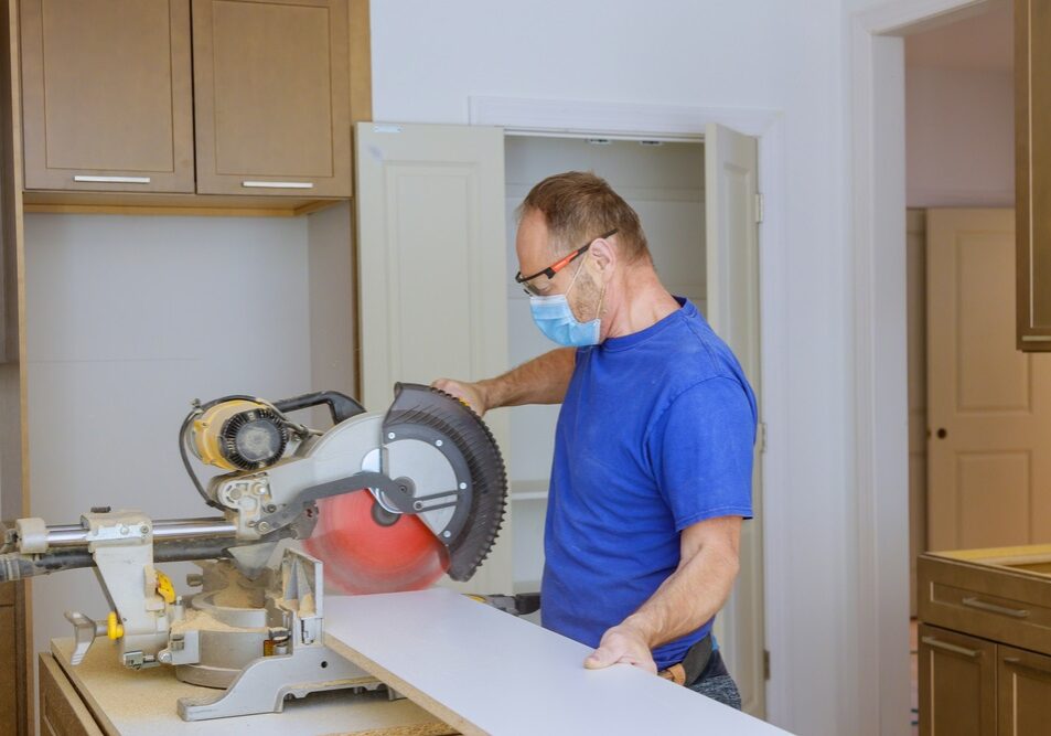 Cutting wood for cabinet with personal protective equipment's Cutting wood for cabinet with personal protective equipments