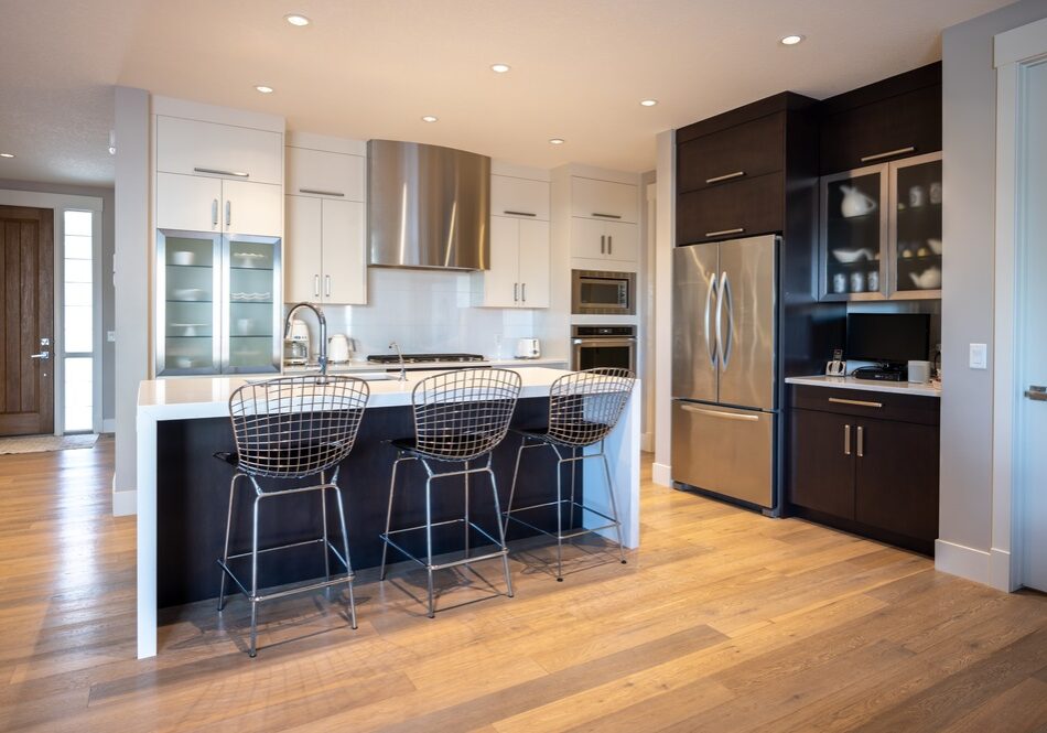 Interior of modern home showing white modern kitchen Interior of modern home showing white modern kitchen