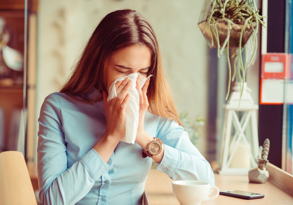 Young woman got runny nose from allergy Young woman got runny nose from allergy